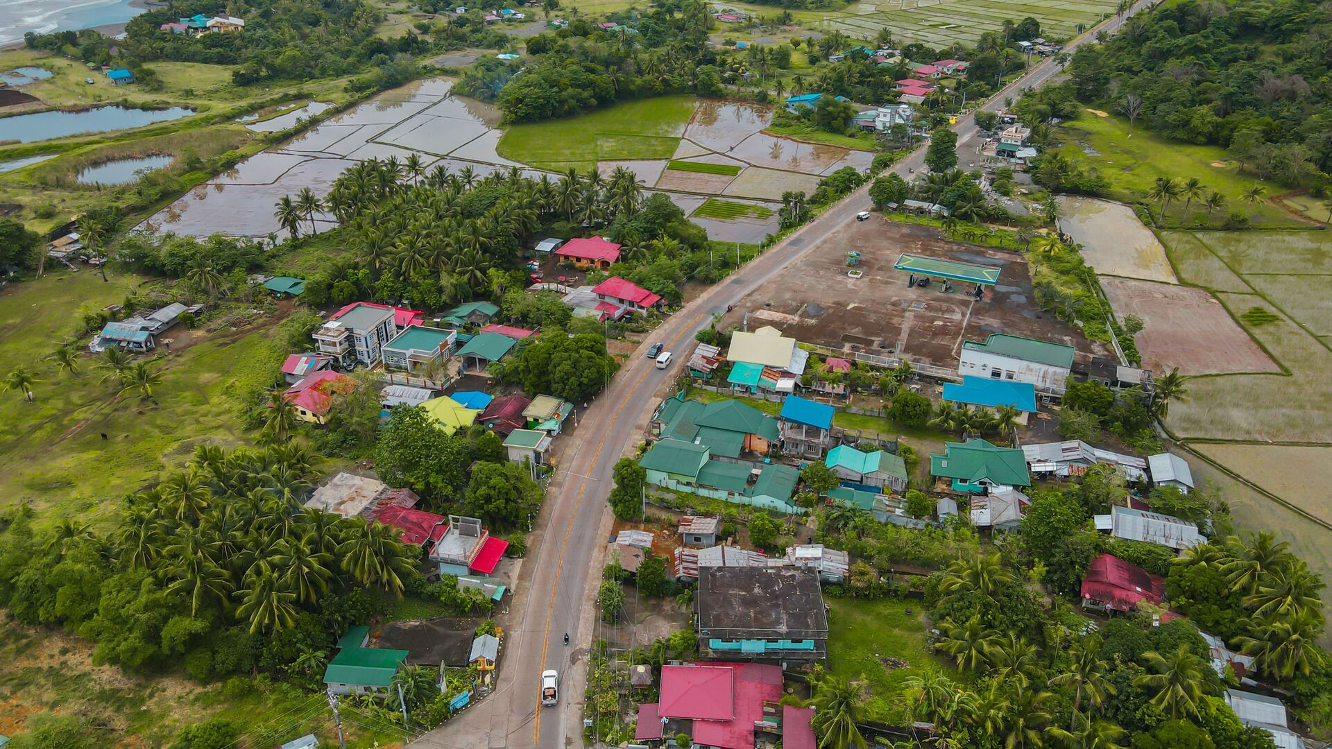 An aerial view of a rural community surrounded by fields